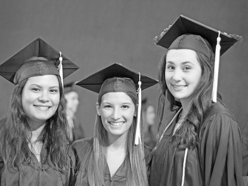 3 girls in cap and gown