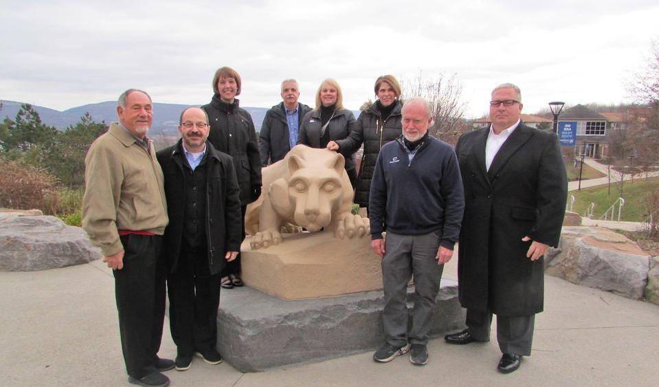 donors and penn state scranton administrators for the new grant posing for a photo at the campus lion shrine